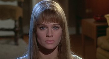 Movie still from “Fahrenheit 451” (1966), directed by François Truffaut – A person with long blonde hair; Close Up shot, Low angle