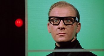 Movie still from “Fahrenheit 451” (1966), directed by François Truffaut – A person wearing glasses; Close Up shot, Low angle