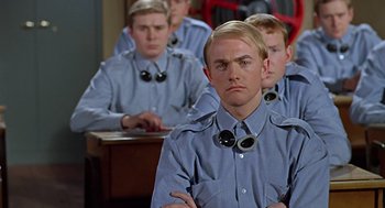 Movie still from “Fahrenheit 451” (1966), directed by François Truffaut – A group of young men sitting at a desk; Close Up shot, High angle