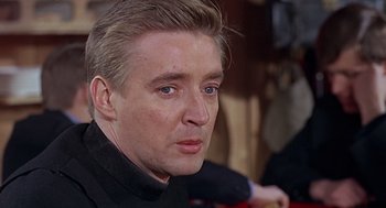 Movie still from “Fahrenheit 451” (1966), directed by François Truffaut – A person wearing a black shirt; Close Up shot, Over the shoulder angle