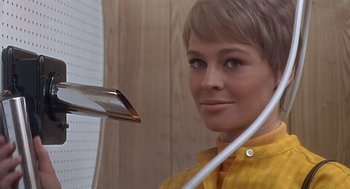 Movie still from “Fahrenheit 451” (1966), directed by François Truffaut – A woman with short blonde hair is holding a phone; Close Up shot, Low angle