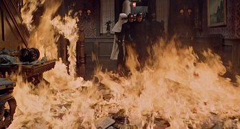 Movie still from “Fahrenheit 451” (1966), directed by François Truffaut – A group of people standing in front of a fire; Wide shot, High angle