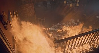 Movie still from “Fahrenheit 451” (1966), directed by François Truffaut – A fire is burning in the middle of a staircase; Wide shot, Overhead angle