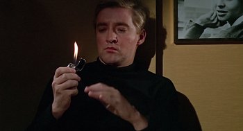 Movie still from “Fahrenheit 451” (1966), directed by François Truffaut – A man is holding a candle in his hand; Close Up shot, High angle