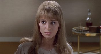Movie still from “Fahrenheit 451” (1966), directed by François Truffaut – A person with long brown hair; Close Up shot, Over the shoulder angle