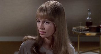 Movie still from “Fahrenheit 451” (1966), directed by François Truffaut – A person with long brown hair; Close Up shot, High angle