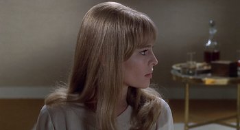 Movie still from “Fahrenheit 451” (1966), directed by François Truffaut – A woman with long blonde hair looking to her left; Close Up shot, Over the shoulder angle
