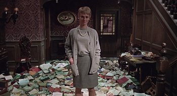 Movie still from “Fahrenheit 451” (1966), directed by François Truffaut – A woman standing in a room covered in papers; Wide shot, High angle
