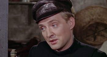 Movie still from “Fahrenheit 451” (1966), directed by François Truffaut – A person wearing a hat; Close Up shot, Over the shoulder angle