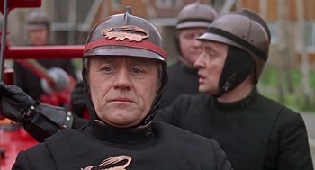 Movie still from “Fahrenheit 451” (1966), directed by François Truffaut – A man wearing a helmet and a black jacket; Close Up shot, Low angle