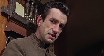 Movie still from “Fahrenheit 451” (1966), directed by François Truffaut – A person wearing a brown jacket; Close Up shot, Low angle