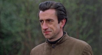 Movie still from “Fahrenheit 451” (1966), directed by François Truffaut – A person wearing a brown jacket; Close Up shot, Over the shoulder angle