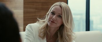 Movie still from “Fair Game” (2010), directed by Doug Liman – A woman with long blonde hair wearing a white jacket; Close Up shot, Over the shoulder angle