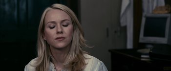 Movie still from “Fair Game” (2010), directed by Doug Liman – A woman with her eyes closed with her eyes closed; Close Up shot, Over the shoulder angle