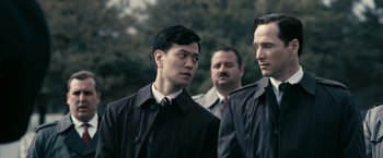 Movie still from “Fair Game” (2010), directed by Doug Liman – A group of men standing next to each other; Close Up shot, Over the shoulder angle