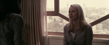 Movie still from “Fair Game” (2010), directed by Doug Liman – A woman sitting in front of a large window; Close Up shot, Over the shoulder angle
