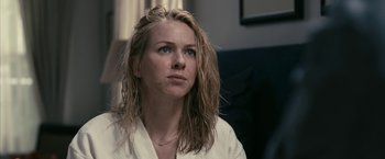 Movie still from “Fair Game” (2010), directed by Doug Liman – A woman sitting in front of a window looking off into the distance; Close Up shot, Over the shoulder angle