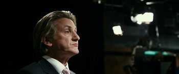 Movie still from “Fair Game” (2010), directed by Doug Liman – An older man in a suit and tie looking off into the distance; Close Up shot, Low angle