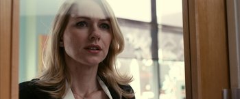 Movie still from “Fair Game” (2010), directed by Doug Liman – A woman with long blonde hair wearing a white shirt; Close Up shot, Over the shoulder angle
