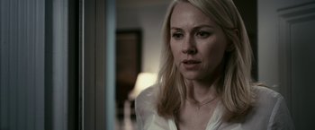 Movie still from “Fair Game” (2010), directed by Doug Liman – A woman in a white shirt looking at the camera; Close Up shot, Over the shoulder angle