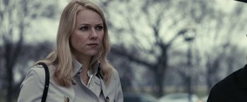 Movie still from “Fair Game” (2010), directed by Doug Liman – A woman with blonde hair wearing a white jacket; Close Up shot, Over the shoulder angle