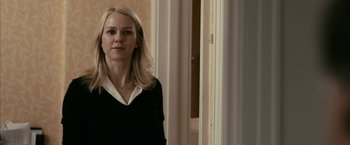 Movie still from “Fair Game” (2010), directed by Doug Liman – A woman standing in front of a window; Close Up shot, Over the shoulder angle