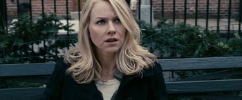 Movie still from “Fair Game” (2010), directed by Doug Liman – A woman with blonde hair is looking at the camera; Close Up shot, Over the shoulder angle