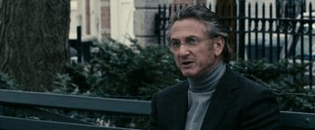 Movie still from “Fair Game” (2010), directed by Doug Liman – An older man wearing a jacket and a sweater; Close Up shot, Over the shoulder angle