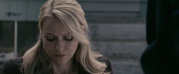 Movie still from “Fair Game” (2010), directed by Doug Liman – A woman with long blonde hair looking down; Close Up shot, Over the shoulder angle