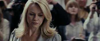 Movie still from “Fair Game” (2010), directed by Doug Liman – A woman with long blonde hair is looking down; Close Up shot, Over the shoulder angle