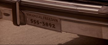 Movie still from “Falling Down” (1993), directed by Joel Schumacher – A sign on the side of a car; Extreme Close Up shot, High angle