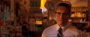 Movie still from “Falling Down” (1993), directed by Joel Schumacher – A person wearing glasses and a tie; Close Up shot, Low angle