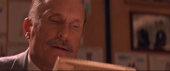 Movie still from “Falling Down” (1993), directed by Joel Schumacher – A person looking at a ruler; Close Up shot, Low angle