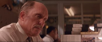 Movie still from “Falling Down” (1993), directed by Joel Schumacher – An older man with a mustache and a mustache stand in front of another man; Close Up shot, Low angle