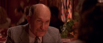 Movie still from “Falling Down” (1993), directed by Joel Schumacher – An older man wearing a suit and a tie; Close Up shot, Low angle