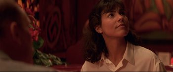 Movie still from “Falling Down” (1993), directed by Joel Schumacher – A person sitting in front of a window; Close Up shot, Low angle