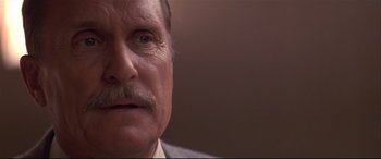Movie still from “Falling Down” (1993), directed by Joel Schumacher – An older man with a mustache and a mustache comb; Close Up shot, Low angle