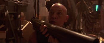 Movie still from “Falling Down” (1993), directed by Joel Schumacher – A bald man holding a gun in his mouth; Close Up shot, Low angle
