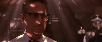 Movie still from “Falling Down” (1993), directed by Joel Schumacher – A person wearing glasses and a tie; Close Up shot, Low angle