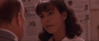 Movie still from “Falling Down” (1993), directed by Joel Schumacher – A person wearing a white shirt; Close Up shot, Low angle