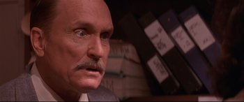 Movie still from “Falling Down” (1993), directed by Joel Schumacher – An old man with a mustache and a bald head; Close Up shot, High angle