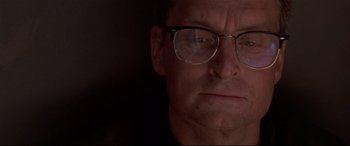 Movie still from “Falling Down” (1993), directed by Joel Schumacher – A person wearing glasses; Close Up shot, Low angle