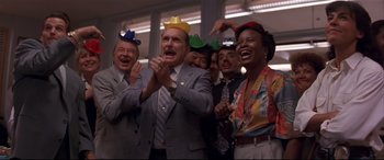 Movie still from “Falling Down” (1993), directed by Joel Schumacher – A group of men and women wearing hats and clapping; Medium shot, Low angle