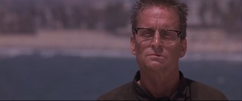 Movie still from “Falling Down” (1993), directed by Joel Schumacher – A person wearing glasses; Close Up shot, Low angle