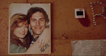 Movie still from “Fandango” (1985), directed by Kevin Reynolds – A picture of a man and a woman on the floor; Extreme Close Up shot, Overhead angle