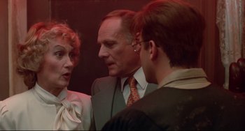 Movie still from “Fandango” (1985), directed by Kevin Reynolds – Two men and a woman talking to each other; Close Up shot, Over the shoulder angle
