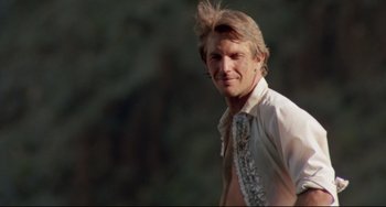 Movie still from “Fandango” (1985), directed by Kevin Reynolds – A person wearing a shirt and tie; Close Up shot, Low angle