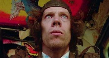 Movie still from “Fandango” (1985), directed by Kevin Reynolds – A person wearing a hat; Close Up shot, Low angle