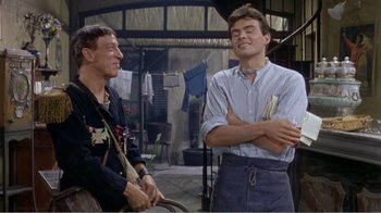 Movie still from “Fanny” (1961), directed by Joshua Logan – Two men are laughing together in a room; Medium shot, Low angle