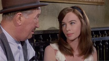 Movie still from “Fanny” (1961), directed by Joshua Logan – A man standing next to a woman in a room; Close Up shot, Over the shoulder angle